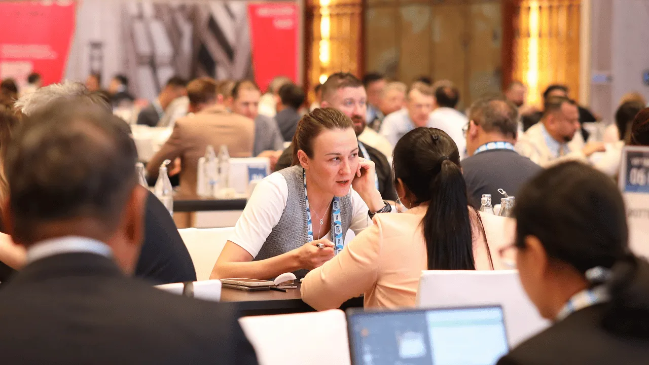 Freight forwarding professionals in conversation during a business networking meeting